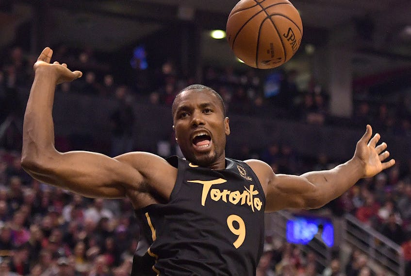 Toronto Raptors centre Serge Ibaka (9) reacts after dunking against the Phoenix Suns in the first half at Scotiabank Arena. (Dan Hamilton-USA TODAY Sports)