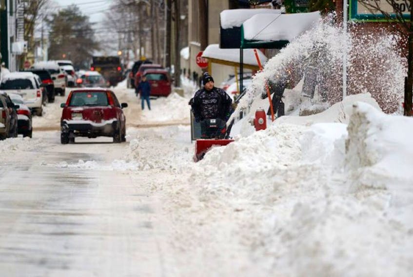 Side walks in many areas of Charlottetown are still blocked with snow and ice so merchants have to clear them.