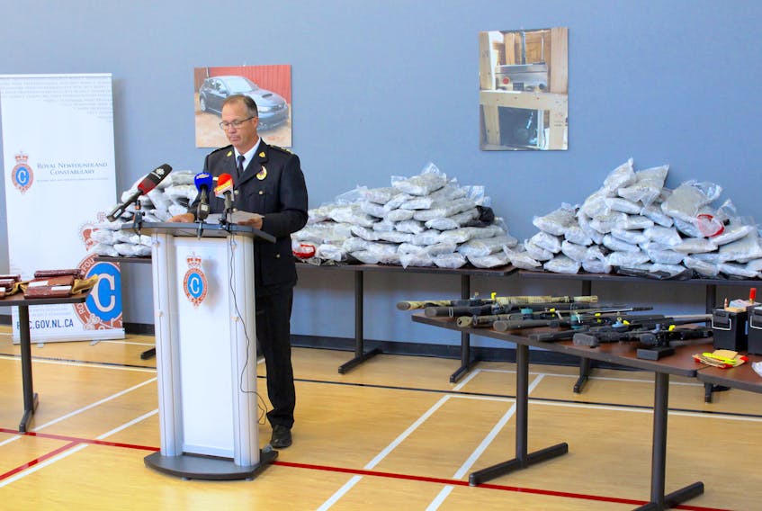RNC superintendent Tom Warren stands in front of $6-million worth of illicit drugs, including 700 pounds of cannabis and quantities of cocaine, magic mushrooms, LSD and MDMA. As well, a pill press, firearms, ammunition, body armour, brass knuckles, over $180,000 cash and two money counters all seized June 30, as part of Operation Rhino. — Andrew Waterman/The Telegram