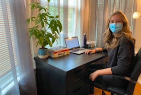 Maddison Hodgins, a fourth-year student in medical sciences at Dalhousie University, works at her desk in Halifax in September 2020.