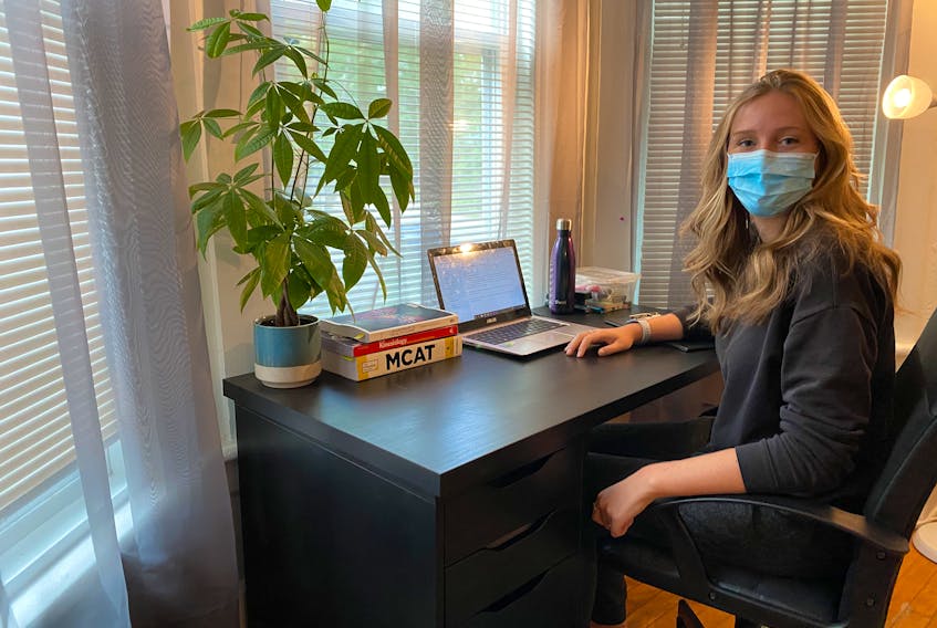Maddison Hodgins, a fourth-year student in medical sciences at Dalhousie University, works at her desk in Halifax in September 2020.