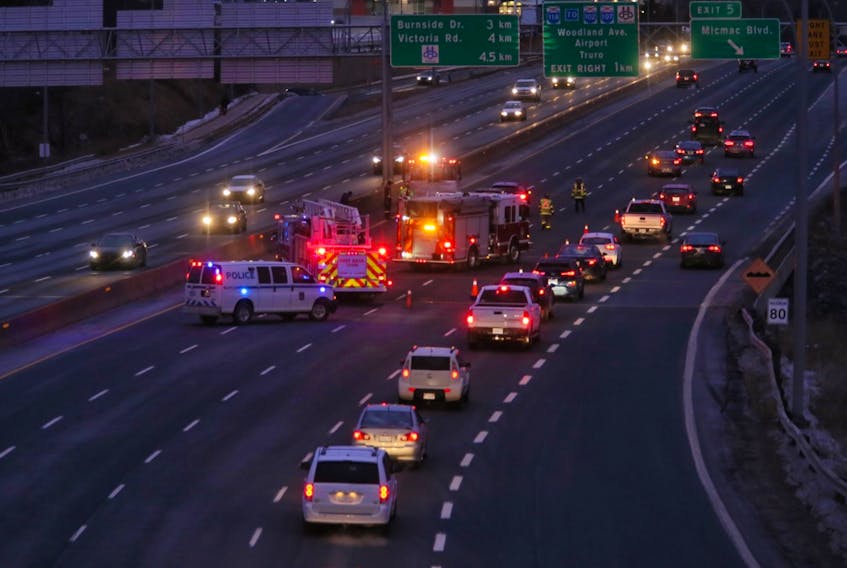 Emergency crews work at the scene of a multi-vehicle crash on Highway 111, near Exit 5, in Dartmouth before 8 a.m. on Monday, Jan. 13, 2020.