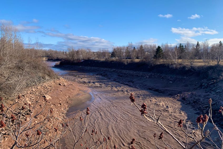 The Avon River trickles along at low tide on Thursday, March 25, 2021, after aboiteau gates were opened.
