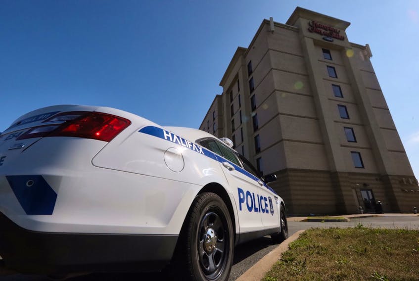 A Halifax Regional Police car is parked at the Hampton Inn & Suites in Dartmouth Crossing on Aug. 13, 2020, after an overnight shooting in a room there. Two males were seen running from the hotel at about 12:35 a.m. after a 20-year-old man was shot in the back.