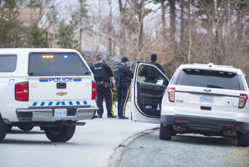 RCMP officers block Leeward Avenue near the entrance to Eastwind Drive in Hammonds Plains on Friday, April 24, 2020 after reports of gunshots of the area.