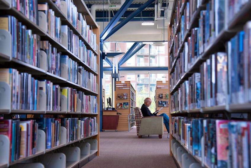 A man reads at the Keshen Goodman Public Library in Halifax, May 28, 2015.