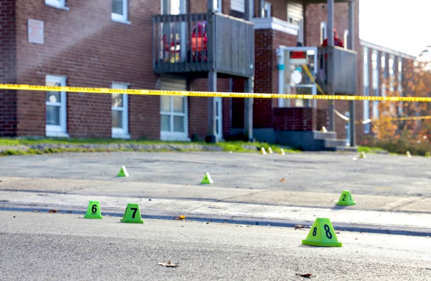 Evidence markers and police tape are visible outside an apartment building on Primrose Street in Dartmouth on Oct. 23, 2020, after the killing of Zachery Grosse, 25. - Tim Krochak