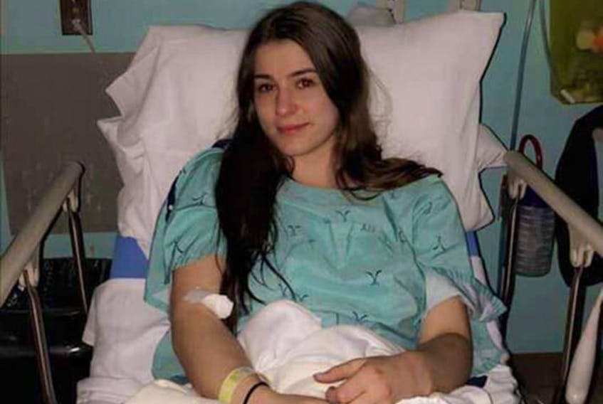 Josee Blinn-Saulnier sits in a hospital bed recovering after she was drugged at a downtown Halifax bar in January 2020.