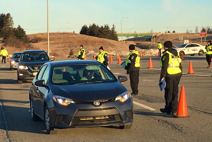 People entering Nova Scotia are directed off the highway just beyond the border early Monday morning. They are being told to self-isolate for 14 days.