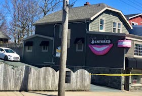 The Atlantic Dental Clinic of Nova Scotia mass shooter Gabriel Wortman on Portland Street in Dartmouth is blocked off by police tape on Sunday, April 19, 2020. On Wednesday, the smile and teeth that decorated the building were removed after a decision by police.
