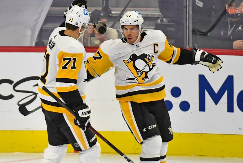 Pittsburgh Penguins captain Sidney Crosby (87) celebrates his goal with Pittsburgh Penguins center Evgeni Malkin (71) against the Philadelphia Flyers during the second period at Wells Fargo Center in Pittsburgh, Penn., on Wednesday, Jan. 13, 2021. - Eric Hartline / USA TODAY Sports