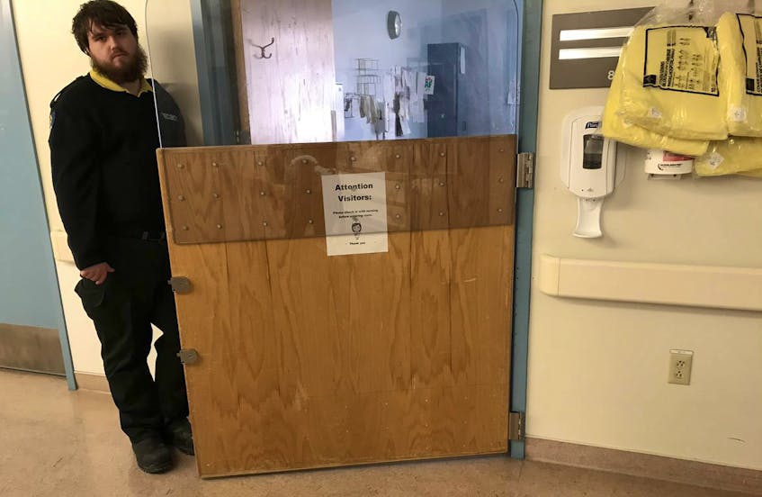 A security guard is stationed outside the room of a man who is abusive to hospital staff and patients at the Halifax Infirmary. The man was admitted two years ago and has healed but is still in the hospital.