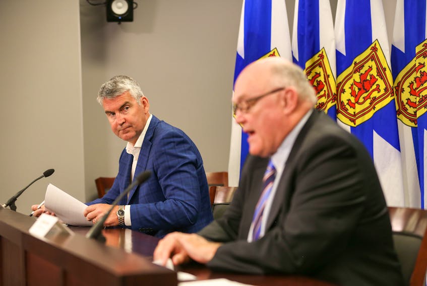 Premier Stephen McNeil listens to Dr. Robert Strang, Nova Scotia's chief medical officer of health, at a COVID-19 news briefing Friday, July 24, 2020.
