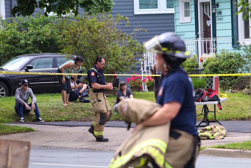 Halifax firefighters wrap up their work after a blaze at an small apartment building at the corner of Connaught and Chebucto avenues Friday morning, July 17, 2020.