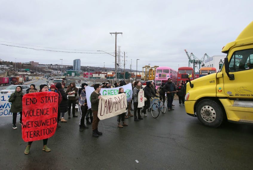 Protesters block a truck at the Fairview Cove container terminal in Halifax on Tuesday, Feb. 11, 2020 in solidarity with the Wet’suwe’ten land defenders.