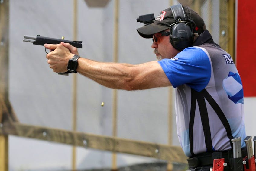 Sean Hansen fires his gun during a national shooting championship at the Ralph Dunn Range on Old Guysborough Road in Devon, N.S., on Friday, July 29, 2016.  Hansen is being investigated as part of a Canada Border Services Agency probe into gun smuggling.  - File