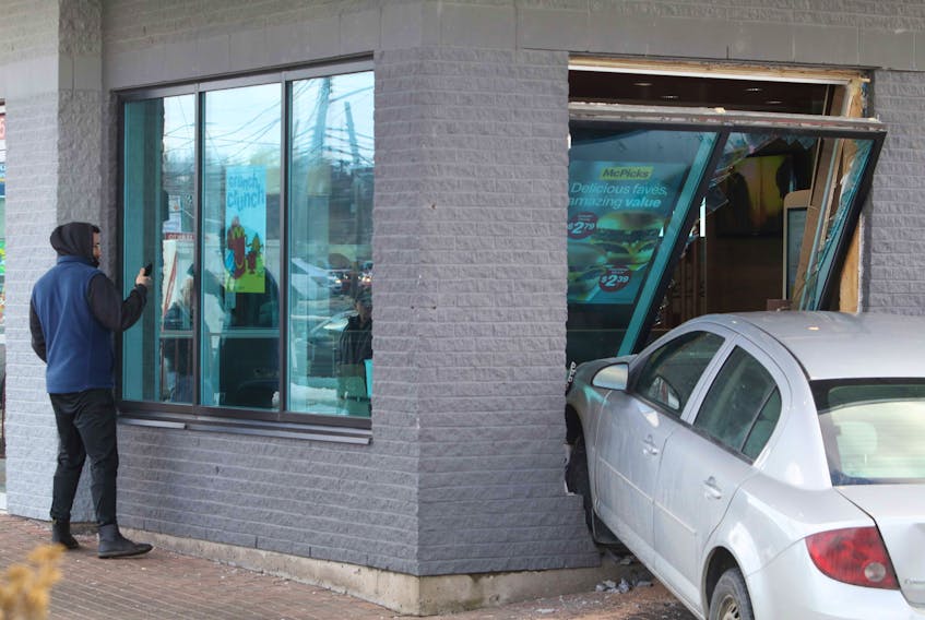 Two people were taken to hospital with undetermined injuries after a vehicle was driven into the McDonald’s on Windmill Road in Dartmouth on Wednesday, Feb. 24, 2021. Police on scene said the table next to the window was blocked off for social distancing, but there was a couple at the adjoining table.