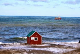 A Canadian Coast Guard ship searches the Bay of Fundy off Hillsburn, Annapolis County, on Wednesday, Dec. 16, 2020 for signs of five missing scallop fishermen or their boat, after the Chief William Saulis went missing early Tuesday morning.