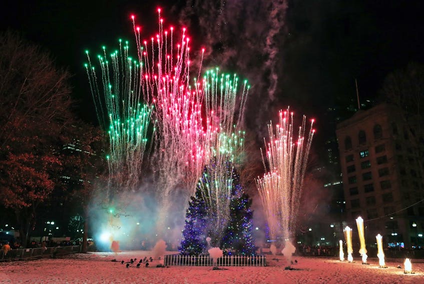 Fireworks explode around the Nova Scotia Christmas tree on Boston Common at the conclusion of the festivities at the 78th annual tree-lighting event on Thursday night, Dec. 5, 2019. - Jim Davis / Boston Globe