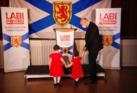 Labour and Advanced Education Minister Labi Kousoulis shows the podium to his daughters, Alexandra, 4, and Olympia, 2, before announcing his bid for the leadership of the Nova Scotia Liberal Party at St. George's Church and Community Centre on Purcell's Cove Road in Halifax on Wednesday, Sept. 30, 2020. He is also MLA for Halifax Citadel-Sable Island.