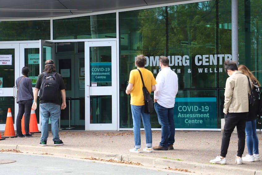 Students line up the Homburg Centre at Saint Mary's University in Halifax, the site of a COVID-19 assessment centre, Tuesday Sept. 29, 2020.