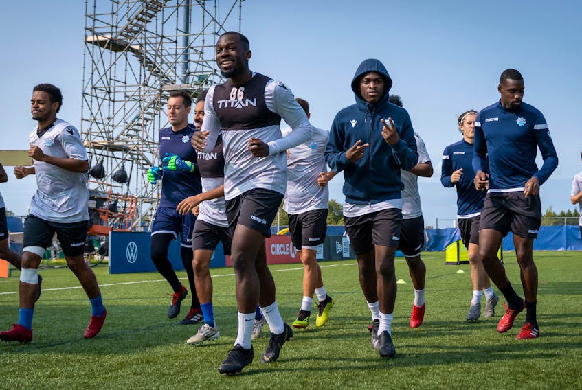 Chrisnovic N’Sa, centre,  lead the HFX Wanderers players in a warmup prior to a training session. The Wanderers will play Forge FC for the Canadian Premier League championship on Saturday, Sept., 19, at 3 p.m. in Charlottetown.