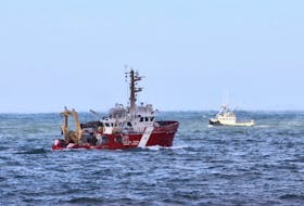 The Canadian Coast Guard Ship M. Perley searches the Bay of Fundy off Hillsburn, Annapolis County, on Wednesday, Dec. 16, 2020 for signs of five missing scallop fishermen or their boat, after the Chief William Saulis went missing early Tuesday morning.