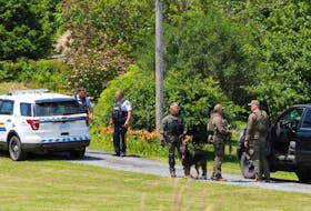 Police search for Tobias Charles Doucette in the Bridgewater area in July 2020. An RCMP dog was stabbed with a pointed stick during the six-day manhunt.