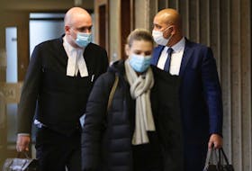 Bassam Al-Rawi, right, a former Halifax taxi driver who was found guilty of sexually assaulting an intoxicated woman in December 2012, and his lawyer Ian Hutchison flank Al-Rawi's wife as they enter Nova Scotia Supreme Court in Halifax on Thursday, Dec. 17, 2020, for Al-Rawi's sentencing hearing.