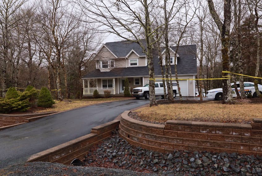 Police vehicles are parked outside a home on Glen Arbour Way in Hammonds Plains on April 3, 2020. RCMP were called to the house the day before and found a woman's body inside.