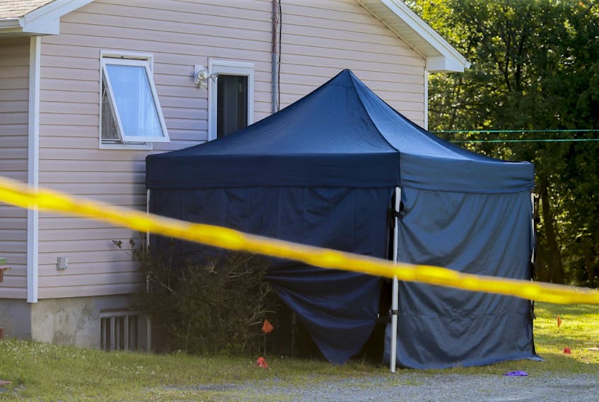 A police tent covers the side of the house on Howard Avenue in Eastern Passage on Friday, July 10, 2020, the day after Mounties shot and killed a man who raised a handgun toward officers outside the home.