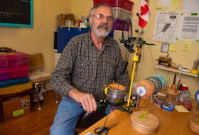 Blake Harris uses a knitting machine to knit wool socks - a skill passed down from his adoptive mother - at his Cole Harbour home on Friday, Nov. 15, 2019. Harris is an advocate for releasing information on adoptions. He found his biological mother almost 20 years ago.