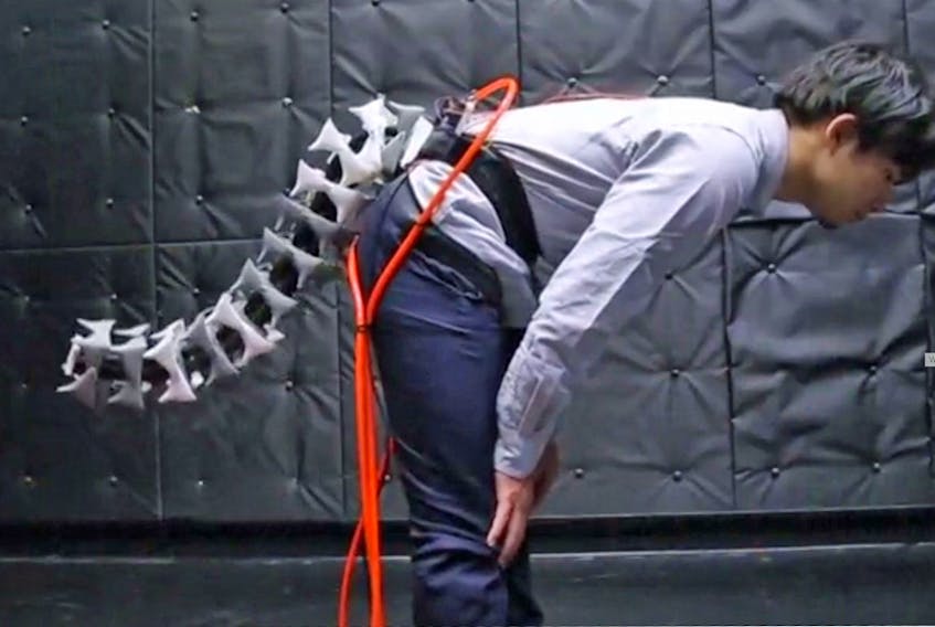 Dubbed Arque, this grey one-metre device mimics tails such as those of cheetahs and other animals used to keep their balance while running and climbing, according to the Japanese research team that developed it.