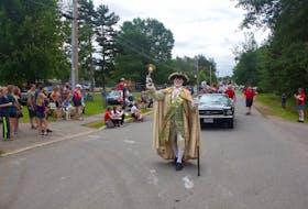 Lloyd Smith, the longest-serving appointed town crier in the country, was at work recently at the Kingston Steer Barbecue. - Paul Pickrem