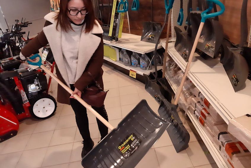 Canadian Tire customer Iris Zhu shops for a shovel in preparation for the winter weather ahead.
