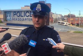 Halifax police spokesman Const. John MacLeod talks to reporters Monday, Oct. 21, 2019 about an incident that ended with a motorist's fatal fall from the Macdonald bridge early that morning.