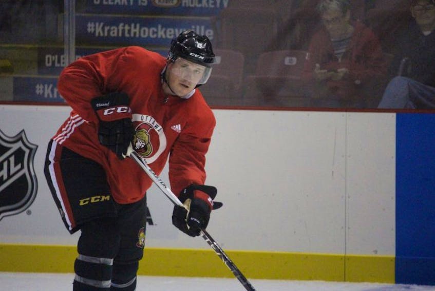 Dion Phaneuf looks to pass during the Ottawa Senators pre-game skate at Credit Union Place. 