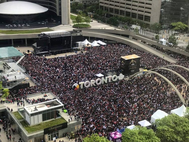 Fans gather in Nathan Phillips Square outside Toronto City Hall ahead of the Raptors rally which will follow the parade, Monday, June 17, 2019. - Emma Kir/Postmedia