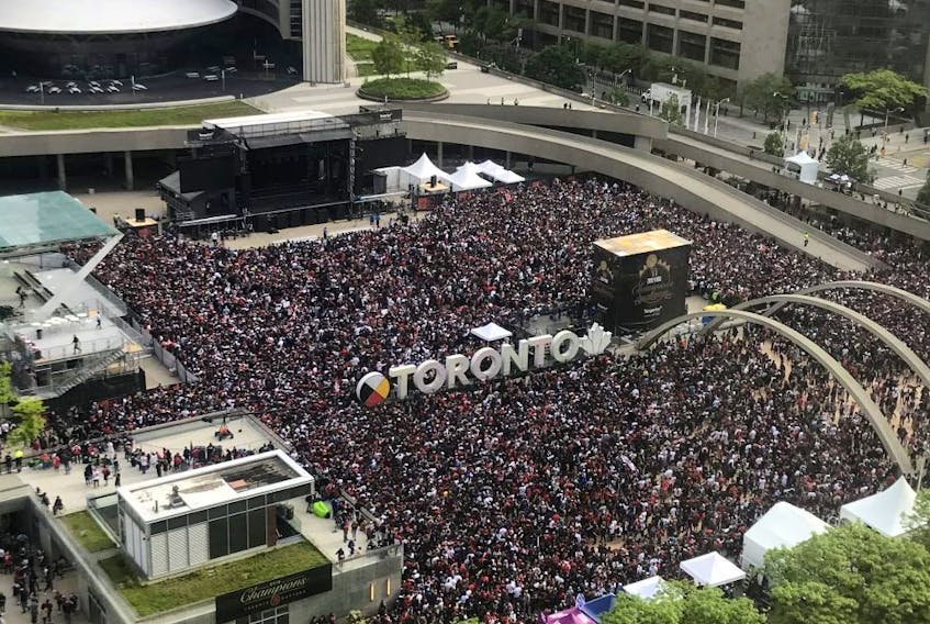 Fans gather in Nathan Phillips Square outside Toronto City Hall ahead of the Raptors rally which will follow the parade, Monday, June 17, 2019. - Emma Kir/Postmedia