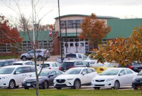 Parents pick up students at West Royalty Elementary School. A funding announcement has raised questions about politicization about expected improvements to the school.