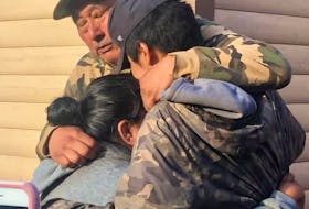 Sebastian Benuen said when he arrived at his home in Sheshatshiu the first thing he and his grandson Aries wanted to do was hug his wife, Damiena. - PHOTO BY JOSIE BENUEN-PONE