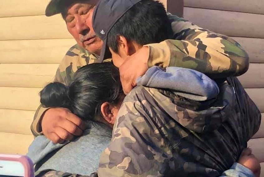 Sebastian Benuen said when he arrived at his home in Sheshatshiu the first thing he and his grandson Aries wanted to do was hug his wife, Damiena. - PHOTO BY JOSIE BENUEN-PONE