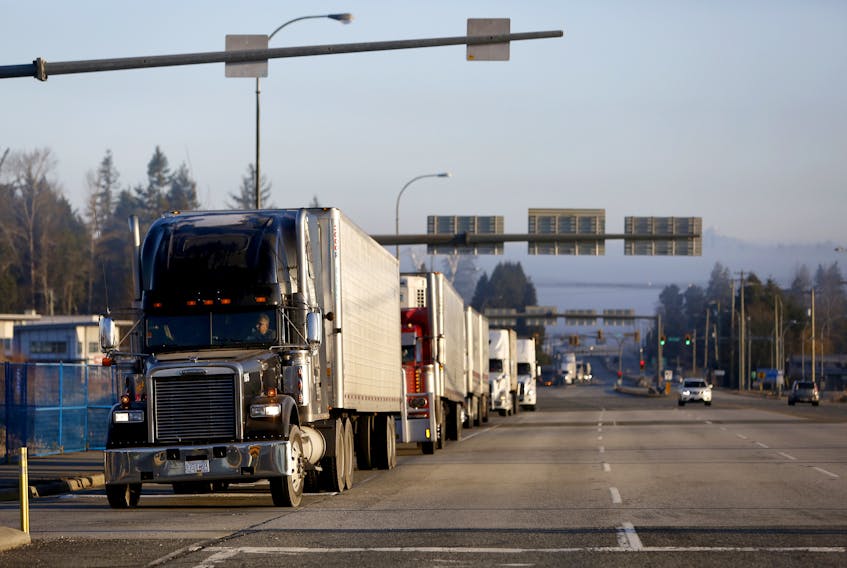 Trucks line up to U.S. customs to enter into Blaine, Wash., at the truck route border crossing.   REUTERS/Jesse Winter 