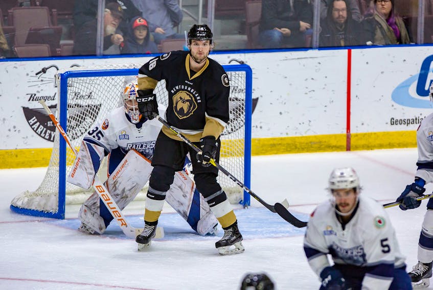 Newfoundland Growlers photo/Jeff Parsons - Hudson Elynuik of the Newfoundland Growlers screens Worcester Railers goalie Mitch Gillam during first-period play in their ECHL game Wednesday night at Mile One Centre. The Growlers won the game 5-2 for their fourth straight victory.