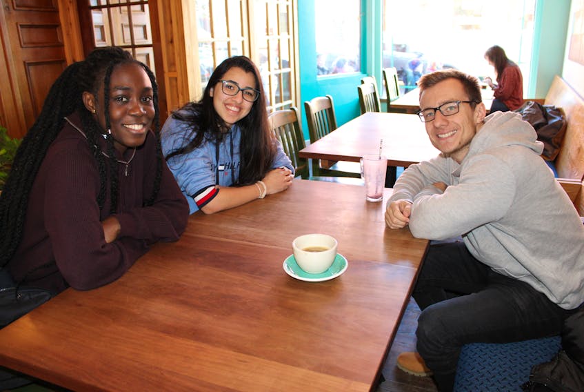 International students from Mount Allison University, l-r, Nana Ofori-Amanfo, Harissa Skaf and Hamish Hallett all have different plans for their holiday break.