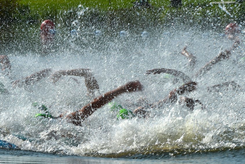 Arms splash in the elite men's 750 metre race during the ITU World Triathlon at Hawrelak Park in Edmonton on July 20, 2019.