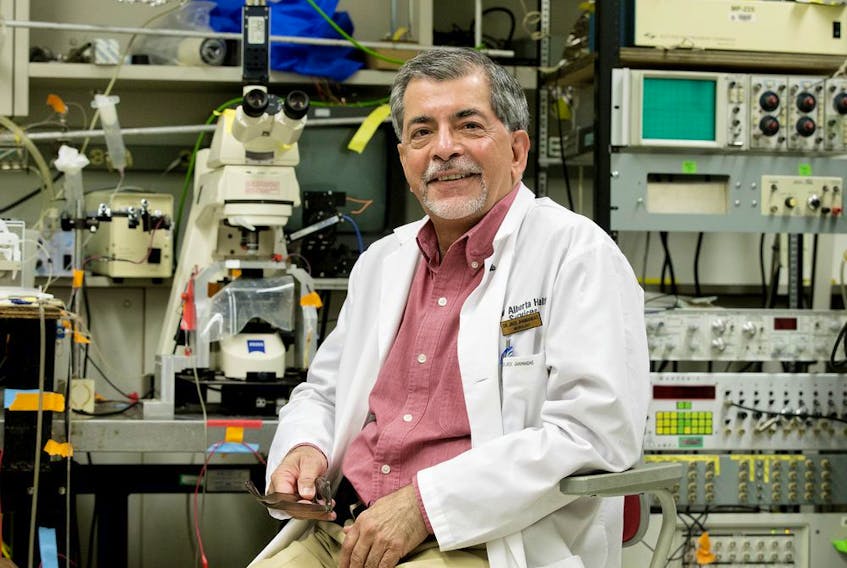 University of Alberta neurologist Jack Jhamandas poses for a photo in his laboratory, in Edmonton Tuesday Sept. 17, 2019. Jhamandas has published a new study that has found that mice injected with two specific strings of amino acids have significantly improved memory. He hopes it is another piece of the puzzle for developing a new, effective Alzheimer's treatment. Photo by David Bloom