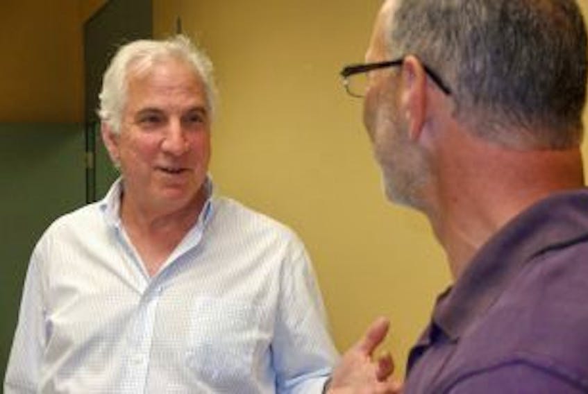 ['Dalhousie University professor Jack Novack speaks with Yarmouth resident Warner Comeau at a municipal recruitment workshop held Friday, May 25 at the Burridge Campus of the Nova Scotia Community College. BELLE HATFIELD PHOTO']