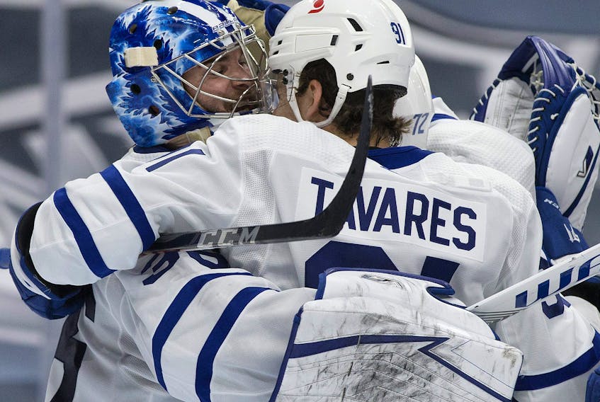 Toronto Maple Leafs' goalie Jack Campbell, left, celebrates his shutout win over the Edmonton Oilers with John Tavares during NHL action at Rogers Place, in Edmonton, Feb. 27, 2021.
