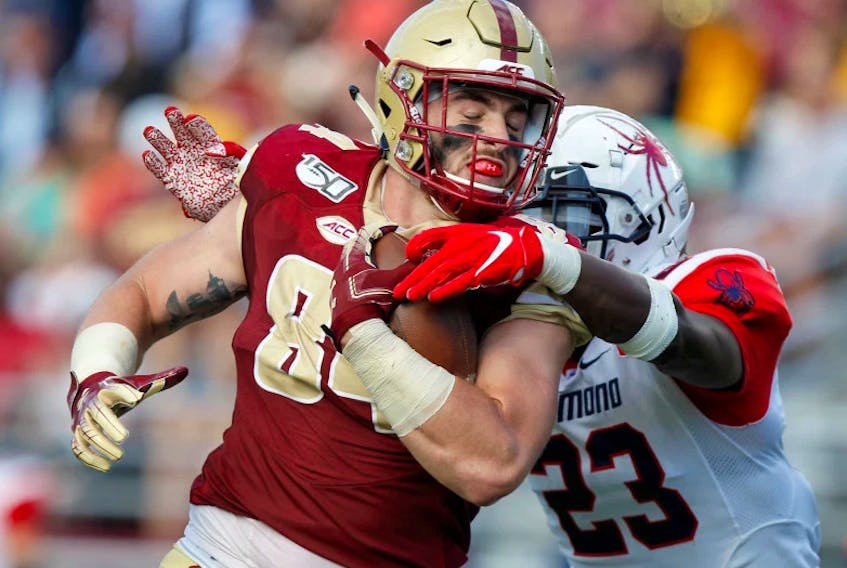 Photo by Paul Connors/Media News Group/Boston Herald/Submitted - Boston College tight end Jake Burt, left, scores a touchdown against Richmond in this September file photo at Alumni Stadium on the campus of Boston College in Boston. Burt, the son of St. John’s natve Scott Burt, was signed as an undrafted free agent by the NFL’s New England Patriots Sunday.